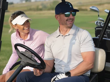 Golf couple in cart